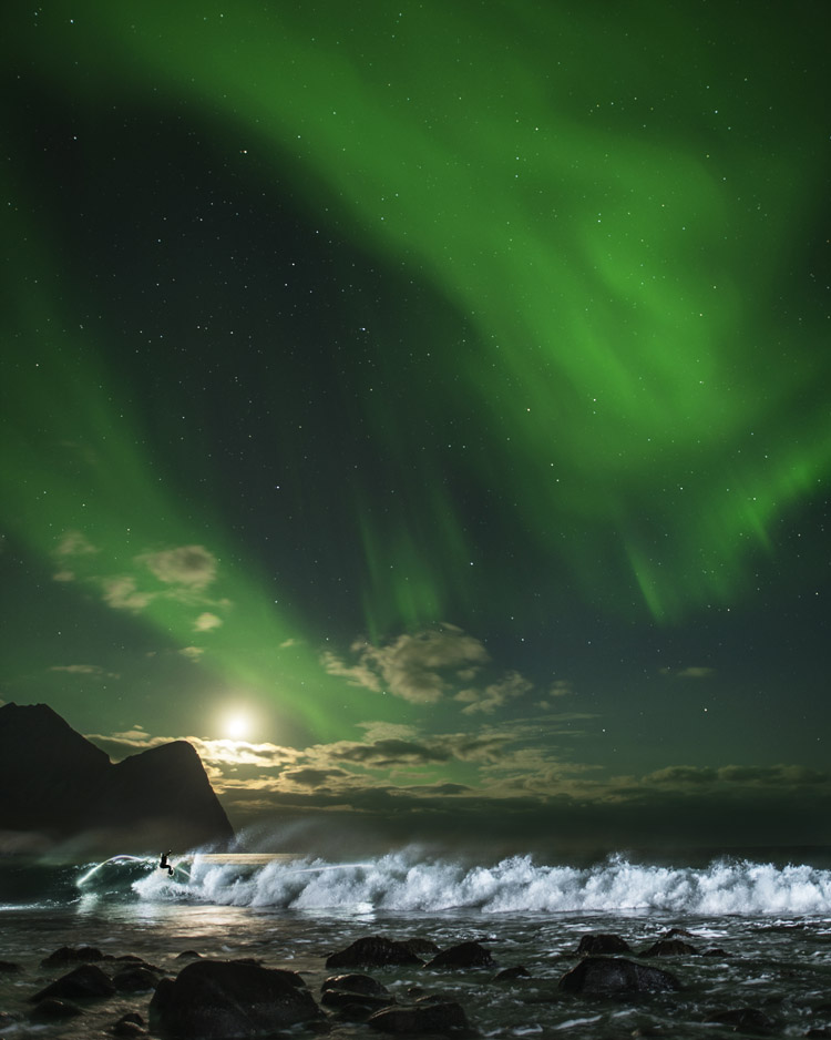Mick Fanning Surfing Under the Aurora Borealis | Image Source: Surfer Today